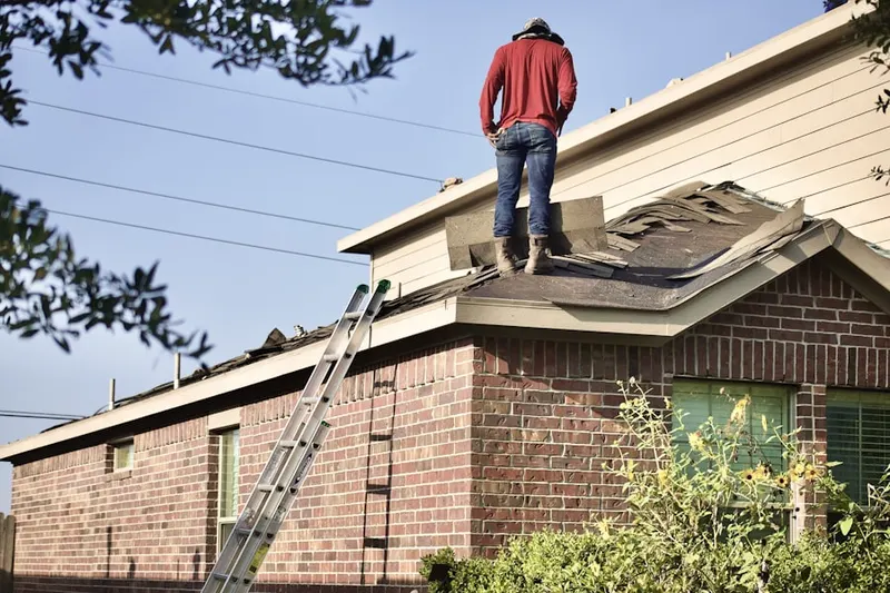 Professional roofer working on a residential roof in Lago Mar